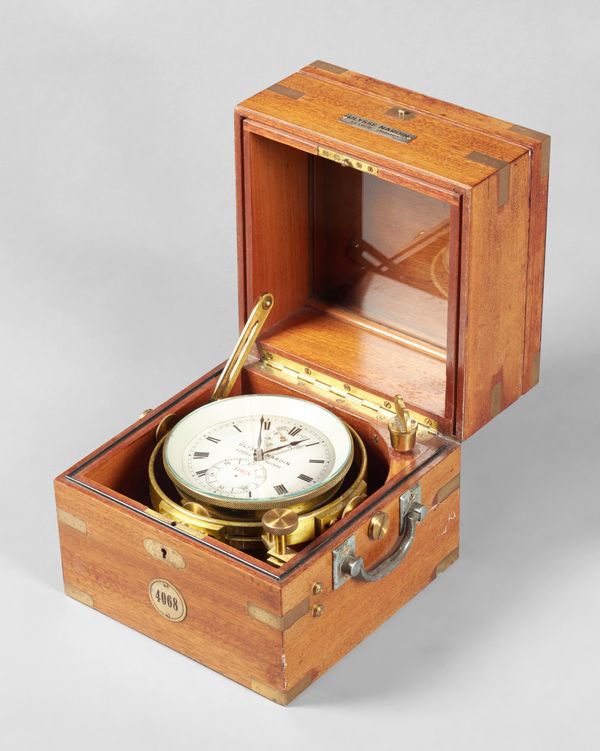 A brass-bound mahogany cased two-day marine chronometerBy Ulysse Nardin, Le Locle, No. 4068, circa 1950The three-piece case with hinged lids, the fron