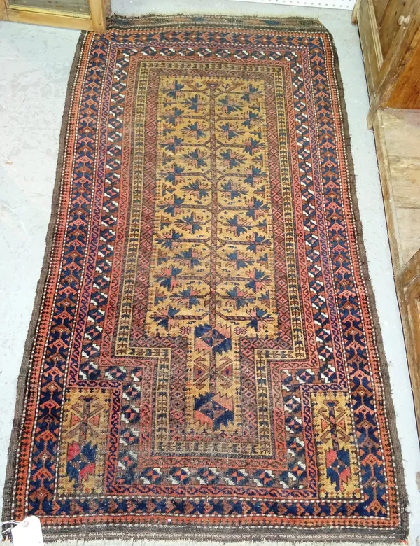 A Baluchistan prayer rug, the fawn mihrab with a stylised flowering tree of life, two supporting panels, various borders, 160cm x 90cm. C10