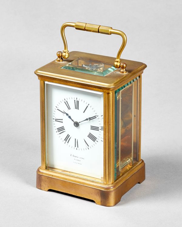 A French gilt brass carriage timepieceCirca 1900In a Corniche case with bevelled glass panels, the movement No. 5058, with distinctive arrow mark for