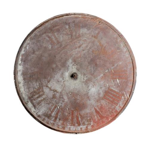 A Victorian 36in. copper turret clock dial Together with under dial wheel-work and a cast-iron wall bracket with projecting spindle(3).  Illustrated