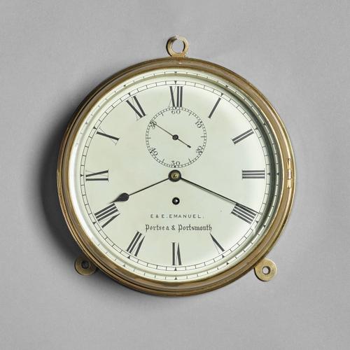 A brass ship's bulkhead timepieceRetailed by E & E. Emanuel, Portsea & Portsmouth, circa 1890The circular brass ring-turned tapering case with cast hi