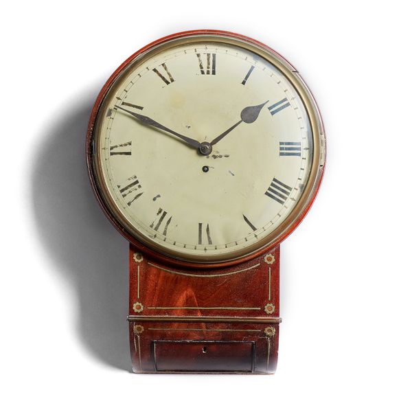 A Regency mahogany and brass-inlaid drop-dial timepieceThe 12in. white painted convex dial with blued spade hands, brass bezel, above a trunk with flo
