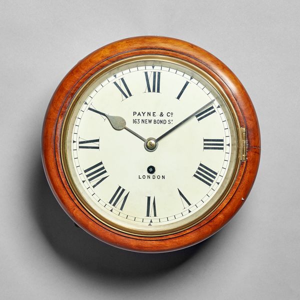A mahogany dial timepieceBy Payne & Co, London, circa 1880The moulded surround with a cast brass glazed bezel, the 8in. white painted dial, with Roman