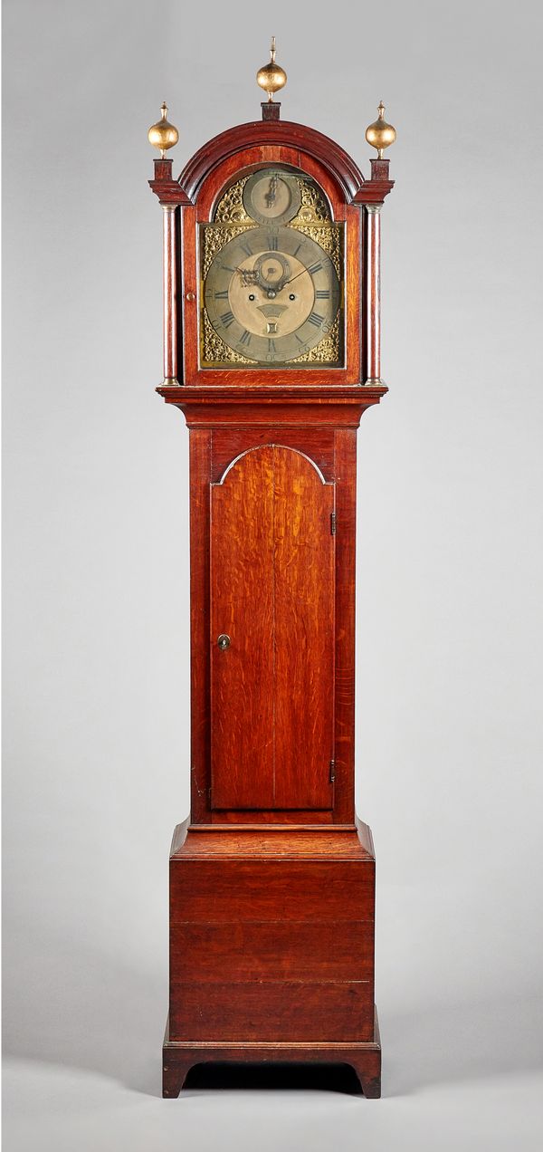 A George III oak longcase clockThe movement by Jacob Riviere, LondonThe case with a broken arched pediment surmounted by three gilt finials, above a g