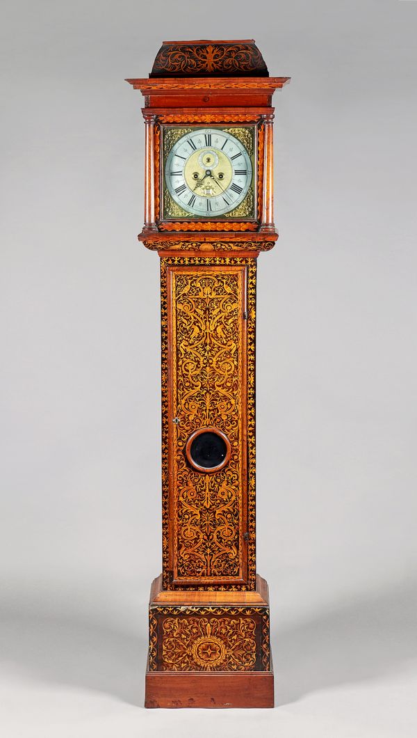 A Queen Anne walnut and arabesque marquetry longcase clockJohn Gammon, London, the case circa 1710 and laterThe hood with a domed scroll marquetry in