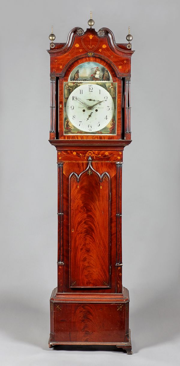 A Regency mahogany and marquetry inlaid longcase clockThe movement by Davies, North ShieldsThe hood with a swan neck pediment, surmounted by three bra