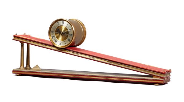 A brass, red perspex and leather-lined inclined plane timepieceDent, London, by Andrew Fell, dated 1973 The drum-shaped case with silvered chapter rin