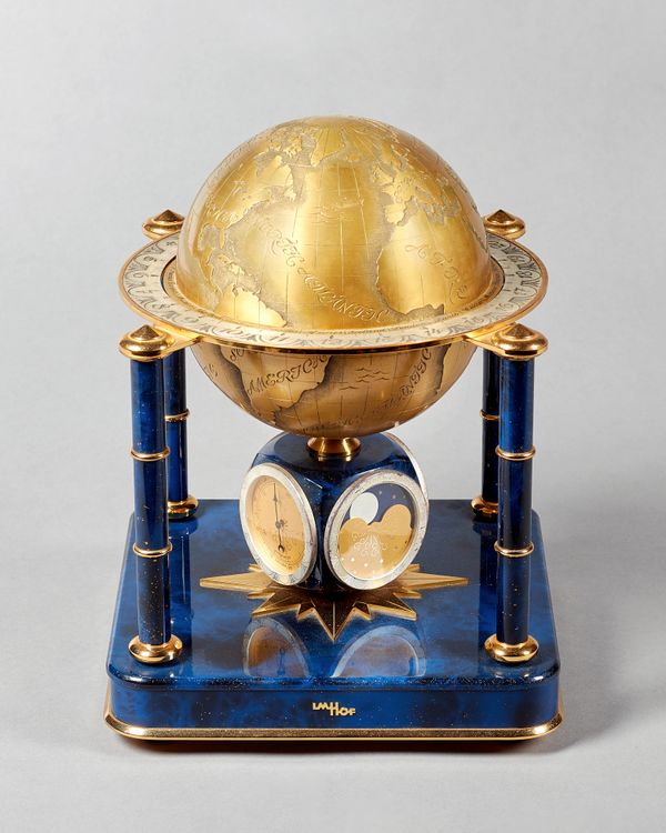 A Swiss gilt metal, silvered and blue enamel world-time compendium table timepieceBy Imhof, No 450 1092, circa 1990Modelled as a rotating globe, with
