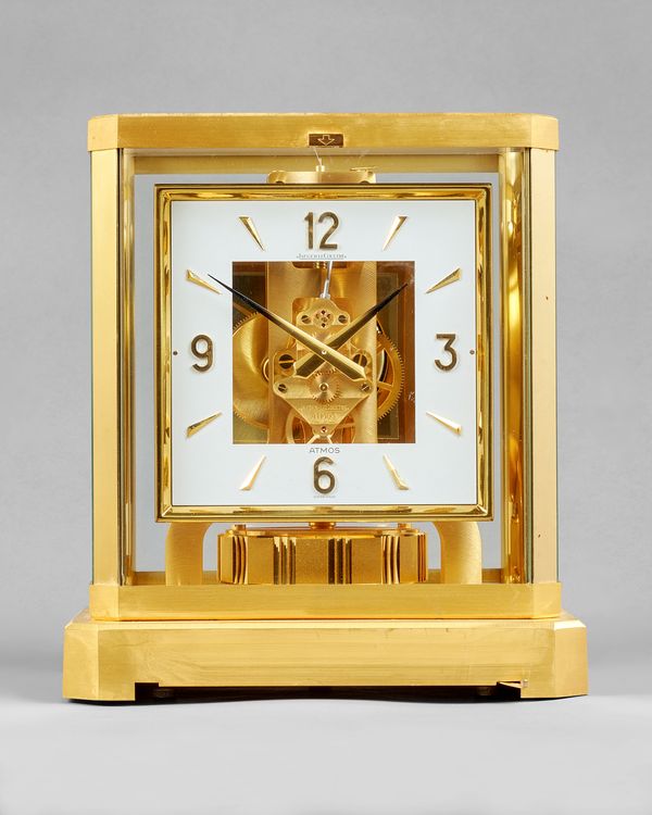 A Swiss brass Atmos timepieceBy Jaeger LeCoultre, No. 435004, circa 1980The glazed brass case with canted angles, with rectangular silvered pierced di