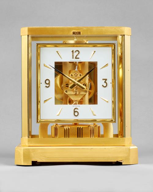 A Swiss brass Atmos timepieceBy Jaeger LeCoultre, No. 435004, circa 1980The glazed brass case with canted angles, with rectangular silvered pierced di