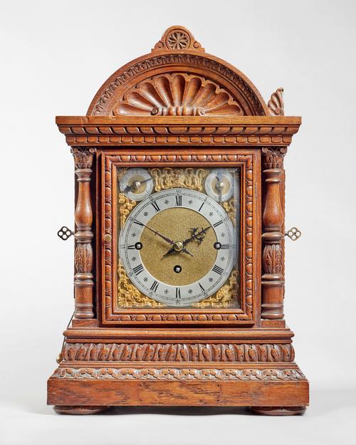 A German oak cased chain fusée three train quarter-chiming and repeating bracket clockBy Winterhalder & Hofmeier, circa 1900The case with a broken arc