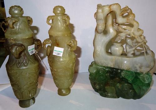 Oriental wares, including; a pair of hardstone lidded vases, together with a soapstone sculpture and an associated rock crystal base. (4) CAB