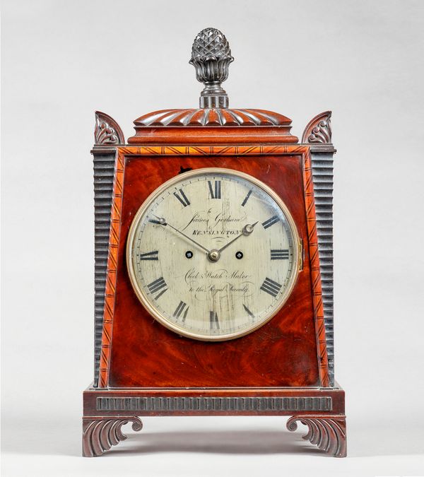 A late Regency mahogany bracket clockIn the manner of Thomas Hope, by James Gorham, Kensington, circa 1820The case with gadrooned pediment, surmounted