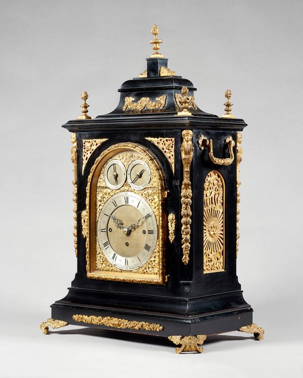 A giltmetal-mounted ebonised three train mantel clock, of large sizeRetailed by Wilson, Penrith, circa 1890The caddy top case with five flaming finial