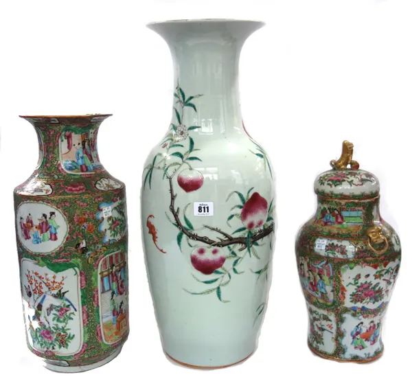 A Chinese porcelain vase, circa 1860, the everted rim painted with a flowering fruit tree (60cm high), a Cantonese vase and cover with gilt lion handl