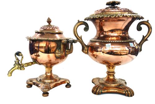 A Victorian copper and brass mounted samovar with turned wooden handles and a brass spout on a shaped square base and four bun feet (31cm high) and an