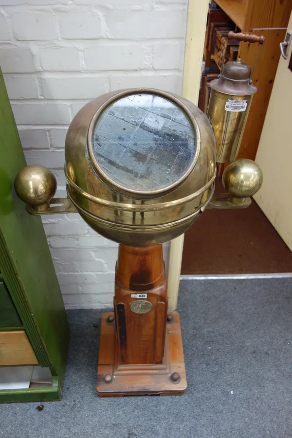 A ship's binnacle, by Solver & Svarrer, early 20th century, with brass hood and oil lamp over a gimble mounted compass and oak stand, with applied bra