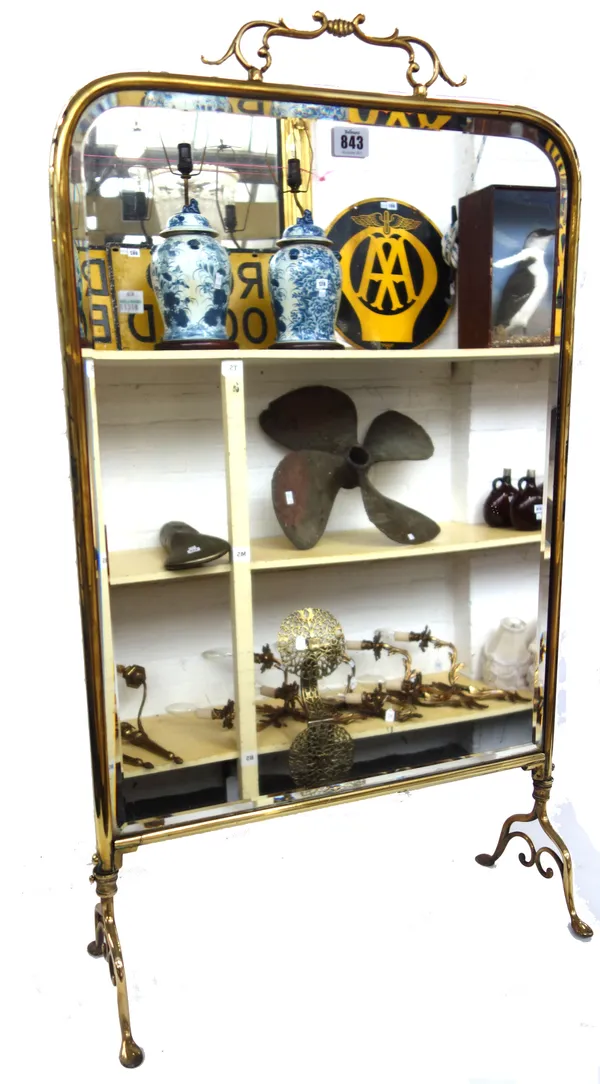 A Victorian brass mirrored fire screen (84cm high), an Adams Style brass coal purdonium and cover and a brass fire fender of Art Nouveau design (115cm