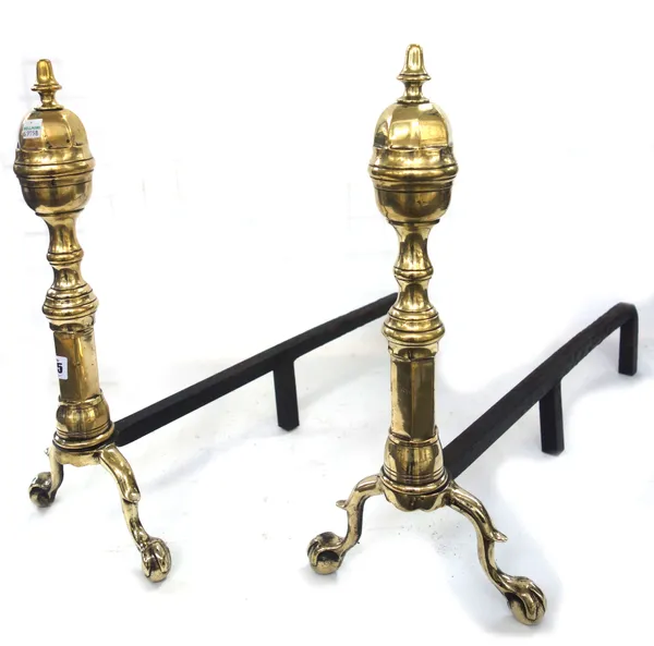 A pair of Georgian brass andirons, with octagonal finials over a turned shaft and two ball and claw feet, 47cm high, (2).