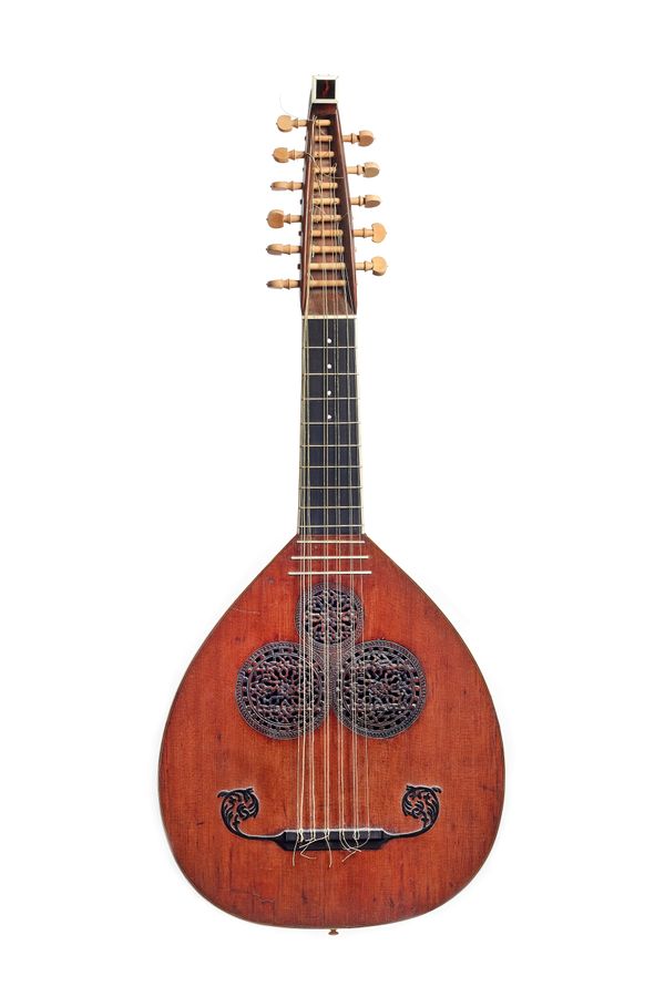 An eleven string English lute guitar by Michael Rauche, signed and dated 1767, with line inlaid body, spruce soundboard with carved and pierced sound