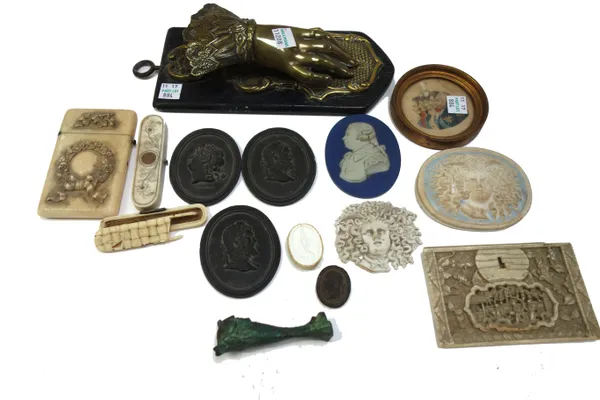 A quantity of small collectables including; a Victorian brass paper clip modelled as a lady's hand on an ebonised plinth, a Regency ivory and pique in