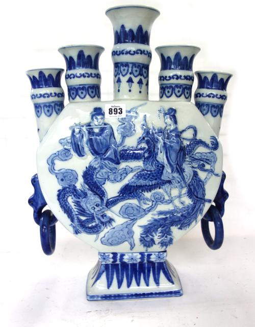 A Chinese blue and white porcelain tulip vase, 20th century, each side moulded and painted with two musicians seated on the back of a dragon and phoen