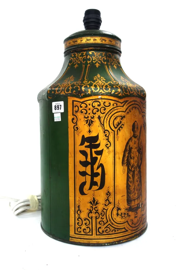 A Victorian japanned tea canister adapted as a table lamp, decorated gilt figure and script against a green ground, canister 46cm high.