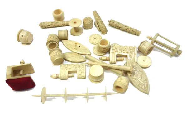 A quantity of Chinese export ivory sewing accessories, circa 1900 mostly florid carved including; needle cases, spools, thread winders, pin cushion cl
