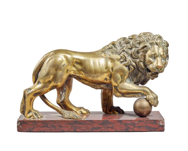 A French gilt bronze Medici lion, circa 1820, after Vacca, modelled and cast standing with right foot raised on a ball, mounted on a griotte marble re