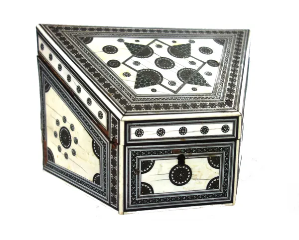An Anglo-Indian sadeli ware sandalwood and ivory inlaid stationery box, circa 1850, of irregular angular outline, the hinged lid opening to reveal a c