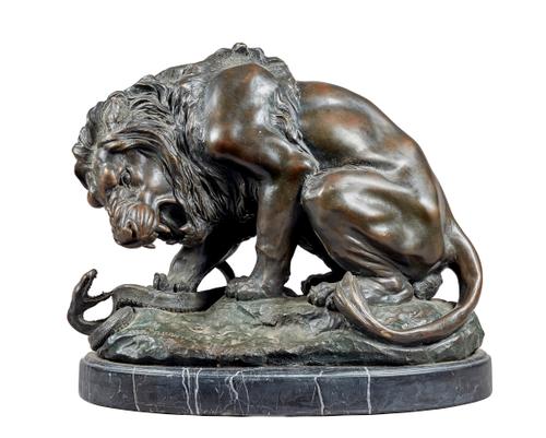After Bayre, 'Lion au Serpent' a patinated bronze model of a lion crushing a snake on a naturalistic base, inscribed 'A.BAYRE' on an oval black marble