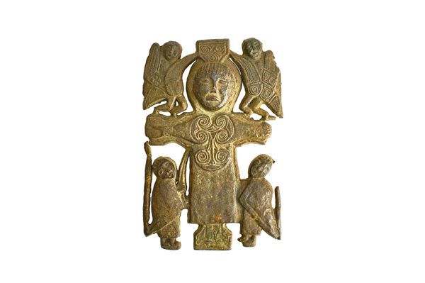 An unusual Celtic bronze plaque, possibly 18th century, cast with a central crucifix shaped figure surrounded by four smaller attendants, 23.5cm high.