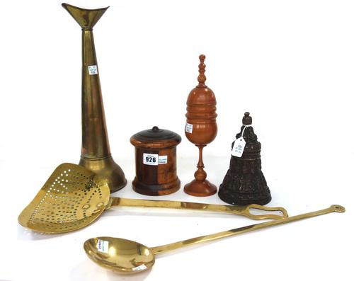 An unusual brass loudhailer, 36.5cm long, a South East Asian bronze bell, relief cast with figures and script, 16.5cm high, a treen boxwood goblet and