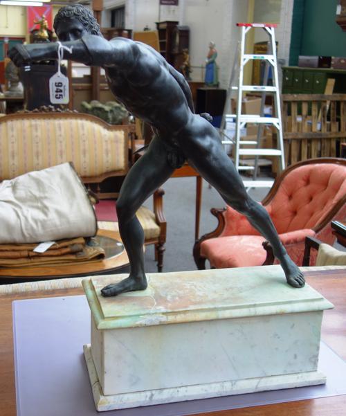 After the Antique, a French patinated bronze figure of a gladiator, late 19th century, modelled naked with sword in his right hand, on a white marble