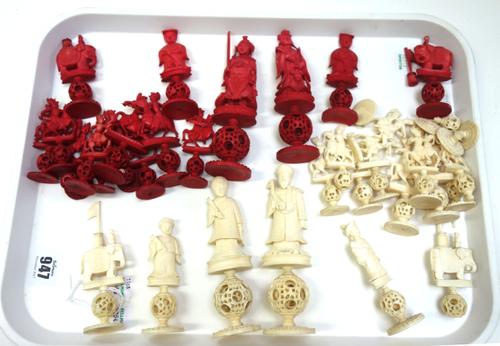 A Chinese export 'Puzzle ball' stained ivory part chess set, early 20th century, each figure carved on a concentric ball and circular lotus pad base (