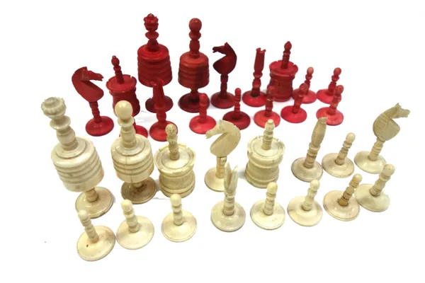 A German 'Barleycorn' pattern stained bone chess set, late 19th century, of turned form (a.f), (King 8cm high).