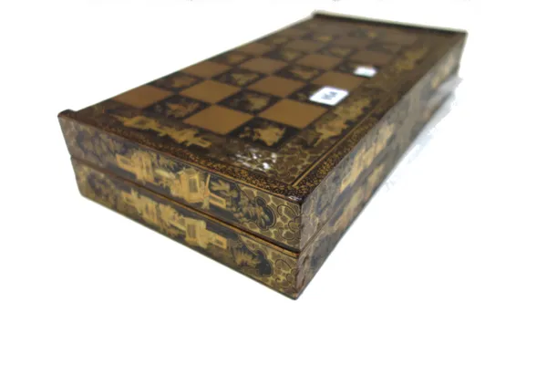 A Chinese export folding chess and backgammon board, early 20th century, with all over chinoiserie decoration and a set of stained ivory chequers, boa