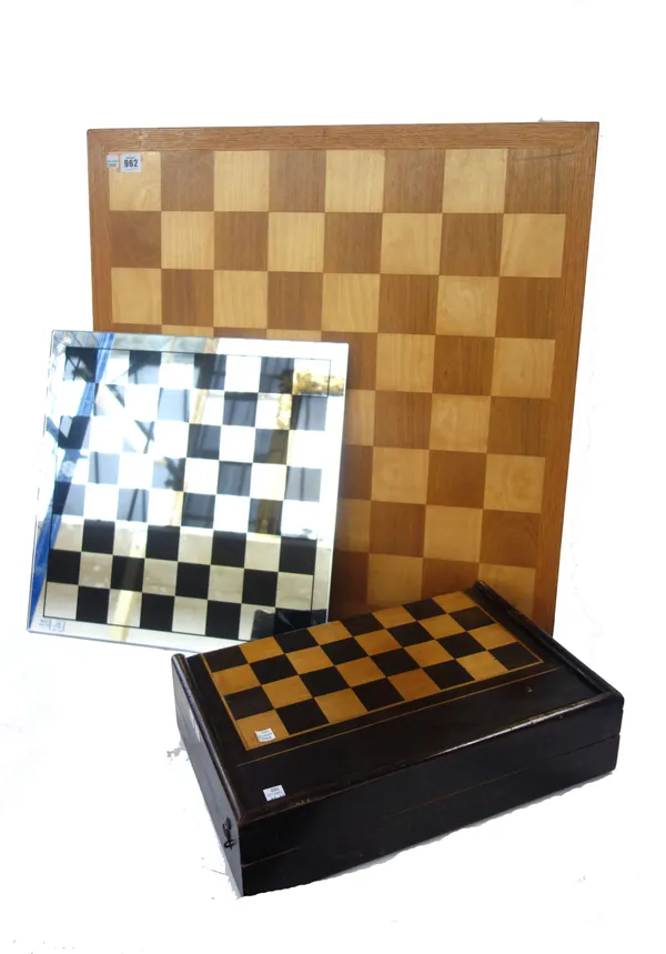 A large wooden chess board, 20th century, stained elm and oak (70cm square), a stained beech folding chess board, with velvet lined backgammon to the