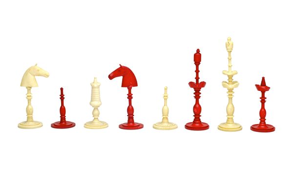 A Chinese export stained ivory chess set, circa 1900, the kings and queens of foliate two tier design (king 9cm high), a set of thirty stained, carved