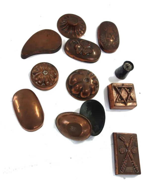 Nine Victorian miniature copper chocolate moulds stamped 'Jones Bros Down St.W', including; an egg, golf clubs, jelly, a clover and others, one furthe