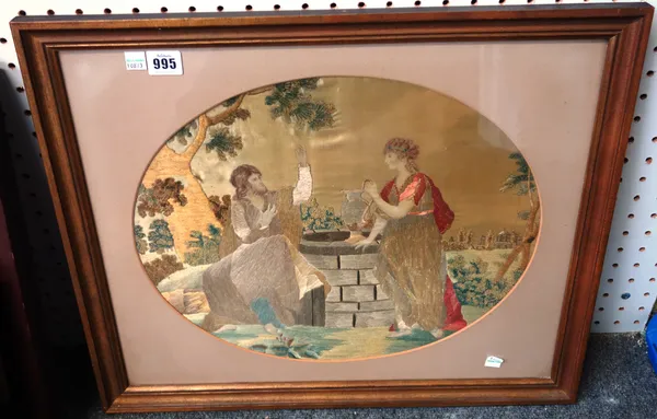 A Regency silkwork picture, possibly depicting Rebecca at the well,  (42cm x 34cm) and one further, smaller foliate silkwork picture, both framed and
