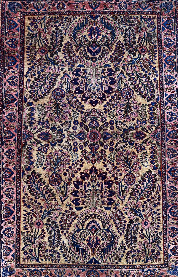 A Sarough rug, Persian, the beige field with allover sprays of flowers, central medallion, the pink palmette and flower border, 200cm x 128cm.  Illust