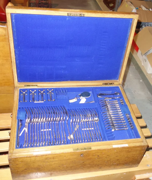 A late Victorian silver plated canteen of King's pattern flatware with three fitted removable trays, in an oak case (parts lacking).   SIM