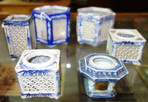 A group of six Oriental porcelain blue and white night light candle holders, 20th century, largest 9cm. high.   CAB