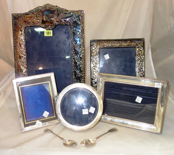A group of five silver picture frames of varying sizes and two silver teaspoons. Part 10 and 11   S4M