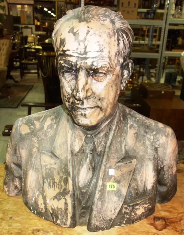A patinated terracotta bust, late 20th century, depicting a gentleman in a blazer, shirt and tie, unsigned, 60cm high.   C4