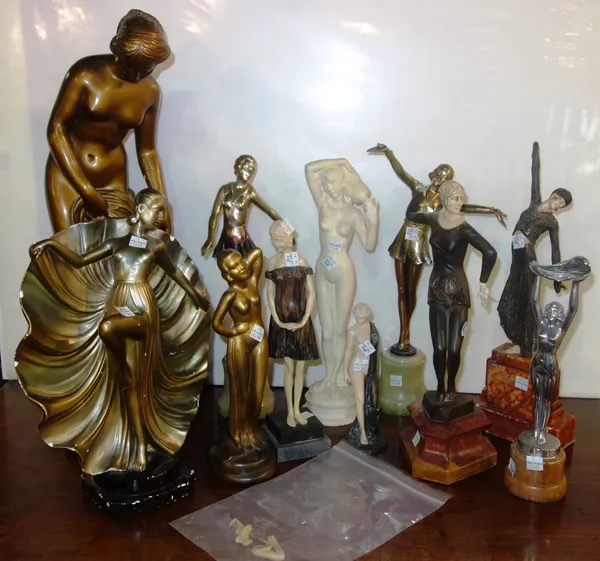In the manner of Lorenzl; figurines in the Art Deco style in various poses, plaster and metal examples, (11).  S4M