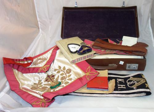 Masonic interest, including; sashes, robes, medals and documents contained in a small brown leather case.  S4T