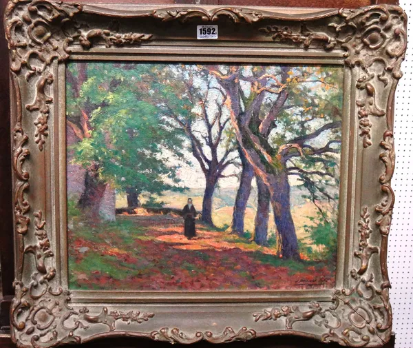 Joseph Milner Kite (1862-1946), A wooded path, oil on canvas, signed, 37cm x 44cm.