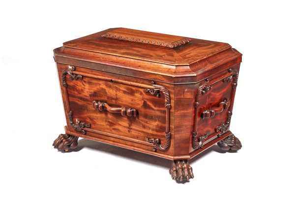 A William IV mahogany cellarette of sarcophagus form, on lions paw feet, 70cm wide x 49cm high x 48cm deep.  Illustrated